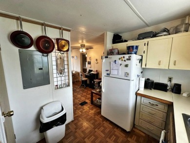 Welcome to your perfect retreat! This cozy 2 bedroom, 1 bathroom on Lake Henry Golf Club in Florida - for sale on GolfHomes.com, golf home, golf lot