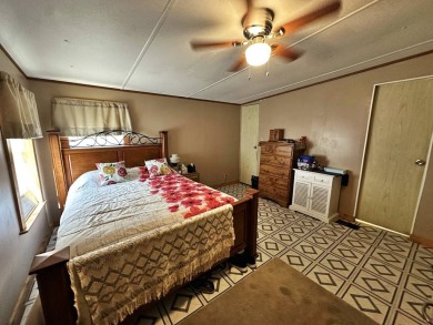 Welcome to your perfect retreat! This cozy 2 bedroom, 1 bathroom on Lake Henry Golf Club in Florida - for sale on GolfHomes.com, golf home, golf lot