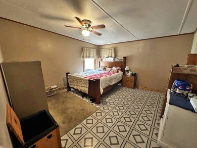 Welcome to your perfect retreat! This cozy 2 bedroom, 1 bathroom on Lake Henry Golf Club in Florida - for sale on GolfHomes.com, golf home, golf lot