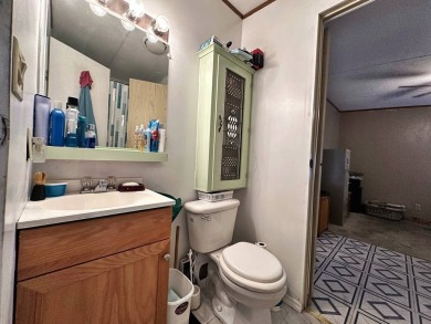 Welcome to your perfect retreat! This cozy 2 bedroom, 1 bathroom on Lake Henry Golf Club in Florida - for sale on GolfHomes.com, golf home, golf lot
