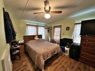 Welcome to your perfect retreat! This cozy 2 bedroom, 1 bathroom on Lake Henry Golf Club in Florida - for sale on GolfHomes.com, golf home, golf lot