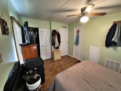 Welcome to your perfect retreat! This cozy 2 bedroom, 1 bathroom on Lake Henry Golf Club in Florida - for sale on GolfHomes.com, golf home, golf lot