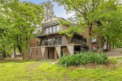 Discover this one-of-a-kind, three-level home nestled on two on Holiday Island Golf Course in Arkansas - for sale on GolfHomes.com, golf home, golf lot
