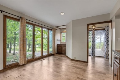 Discover this one-of-a-kind, three-level home nestled on two on Holiday Island Golf Course in Arkansas - for sale on GolfHomes.com, golf home, golf lot