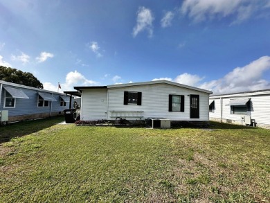 Welcome to your perfect retreat! This cozy 2 bedroom, 1 bathroom on Lake Henry Golf Club in Florida - for sale on GolfHomes.com, golf home, golf lot