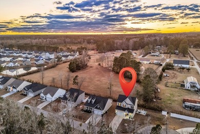 Welcome to this stunning two-story, three-bedroom on Shaftesbury Glen Golf and Fish Club in South Carolina - for sale on GolfHomes.com, golf home, golf lot