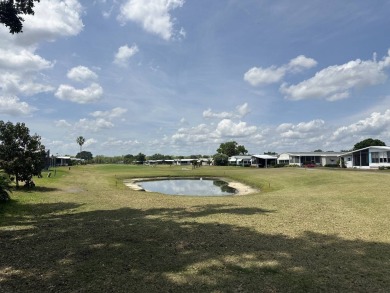 Welcome to your perfect retreat! This cozy 2 bedroom, 1 bathroom on Lake Henry Golf Club in Florida - for sale on GolfHomes.com, golf home, golf lot