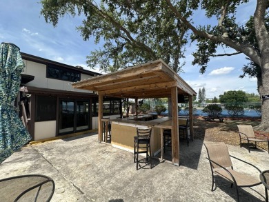 Welcome to your perfect retreat! This cozy 2 bedroom, 1 bathroom on Lake Henry Golf Club in Florida - for sale on GolfHomes.com, golf home, golf lot