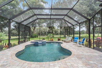 STUNNING POOL HOME located in the prestigious Lake Jovita Golf on Lake Jovita Golf and Country Club in Florida - for sale on GolfHomes.com, golf home, golf lot