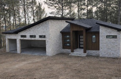 Enjoy modern living with scenic golf course views in this on Granada Golf Course in Arkansas - for sale on GolfHomes.com, golf home, golf lot