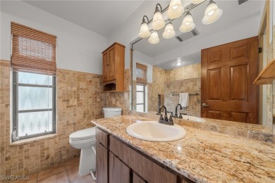 Charming 3BR/3BA Home with Golf & Lake Views - Prime Location! on Spanish Wells Golf and Country Club in Florida - for sale on GolfHomes.com, golf home, golf lot