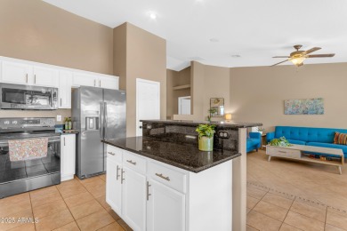This single level home in The Villages at Queen Creek sits on a on Las Colinas Golf Club in Arizona - for sale on GolfHomes.com, golf home, golf lot