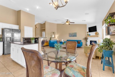 This single level home in The Villages at Queen Creek sits on a on Las Colinas Golf Club in Arizona - for sale on GolfHomes.com, golf home, golf lot