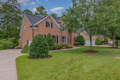 The heart of the home is a gorgeous custom kitchen with sleek on Brier Creek Country Club in North Carolina - for sale on GolfHomes.com, golf home, golf lot
