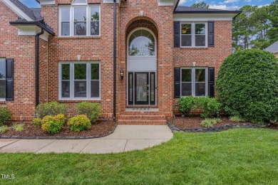 The heart of the home is a gorgeous custom kitchen with sleek on Brier Creek Country Club in North Carolina - for sale on GolfHomes.com, golf home, golf lot