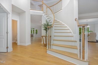 The heart of the home is a gorgeous custom kitchen with sleek on Brier Creek Country Club in North Carolina - for sale on GolfHomes.com, golf home, golf lot