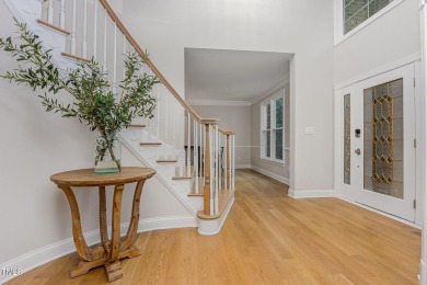 The heart of the home is a gorgeous custom kitchen with sleek on Brier Creek Country Club in North Carolina - for sale on GolfHomes.com, golf home, golf lot