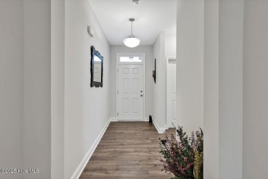 Welcome to this beautifully maintained coastal cottage located on Carolina National Golf Club in North Carolina - for sale on GolfHomes.com, golf home, golf lot