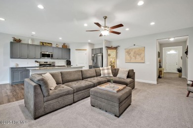 Welcome to this beautifully maintained coastal cottage located on Carolina National Golf Club in North Carolina - for sale on GolfHomes.com, golf home, golf lot