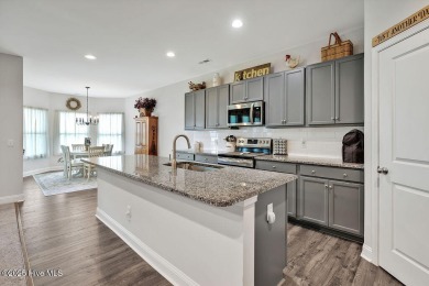 Welcome to this beautifully maintained coastal cottage located on Carolina National Golf Club in North Carolina - for sale on GolfHomes.com, golf home, golf lot