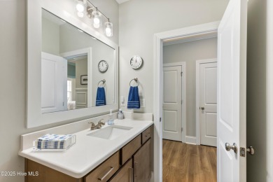 This like new, charming residence, built in 2023 by Bill Clark on Compass Pointe Golf Course in North Carolina - for sale on GolfHomes.com, golf home, golf lot