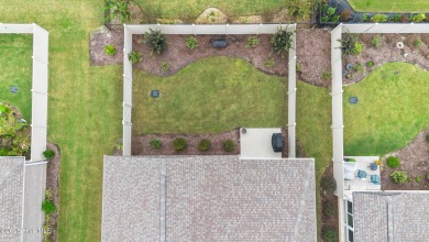 This like new, charming residence, built in 2023 by Bill Clark on Compass Pointe Golf Course in North Carolina - for sale on GolfHomes.com, golf home, golf lot