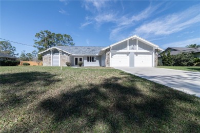 Beautiful, move in a ready canal home in the highly desirable on The Grand Club - Pine Lakes Course in Florida - for sale on GolfHomes.com, golf home, golf lot