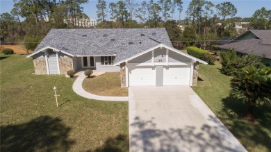 Beautiful, move in a ready canal home in the highly desirable on The Grand Club - Pine Lakes Course in Florida - for sale on GolfHomes.com, golf home, golf lot