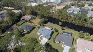 Beautiful, move in a ready canal home in the highly desirable on The Grand Club - Pine Lakes Course in Florida - for sale on GolfHomes.com, golf home, golf lot