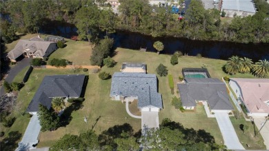 Beautiful, move in a ready canal home in the highly desirable on The Grand Club - Pine Lakes Course in Florida - for sale on GolfHomes.com, golf home, golf lot