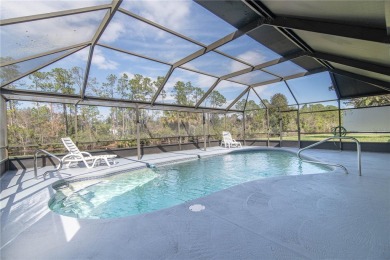 Beautiful, move in a ready canal home in the highly desirable on The Grand Club - Pine Lakes Course in Florida - for sale on GolfHomes.com, golf home, golf lot