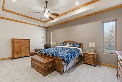 Poised beneath a canopy of mature trees on a gorgeous one-acre on Sugar Tree Golf and Country Club in Texas - for sale on GolfHomes.com, golf home, golf lot