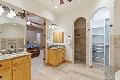 Poised beneath a canopy of mature trees on a gorgeous one-acre on Sugar Tree Golf and Country Club in Texas - for sale on GolfHomes.com, golf home, golf lot