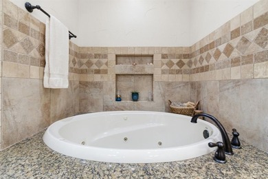 Poised beneath a canopy of mature trees on a gorgeous one-acre on Sugar Tree Golf and Country Club in Texas - for sale on GolfHomes.com, golf home, golf lot