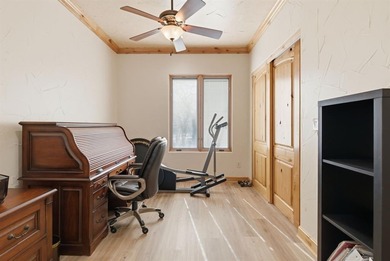 Poised beneath a canopy of mature trees on a gorgeous one-acre on Sugar Tree Golf and Country Club in Texas - for sale on GolfHomes.com, golf home, golf lot