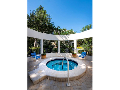 Sweeping bay views and refined comfort define this beautifully on Longboat Key Golf Club Resort in Florida - for sale on GolfHomes.com, golf home, golf lot