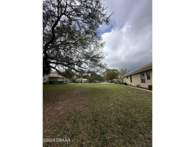 Ready to build, cleared, extra long lot in 24/7 guard gated on Plantation Bay Golf and Country Club in Florida - for sale on GolfHomes.com, golf home, golf lot