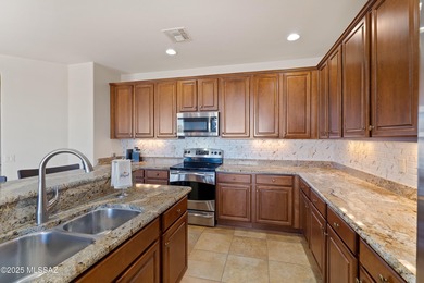 This stunning Mateo model is perfectly positioned on a premium on Saddlebrooke Ranch Golf Club in Arizona - for sale on GolfHomes.com, golf home, golf lot