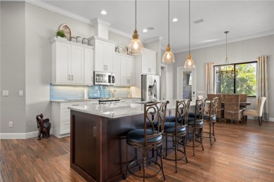 Luxury waterfront living awaits in this custom residence located on Twin Isles Country Club in Florida - for sale on GolfHomes.com, golf home, golf lot