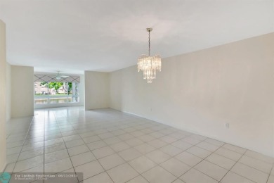 Experience stunning lake views from this beautifully updated on Westchester Golf and Country Club in Florida - for sale on GolfHomes.com, golf home, golf lot
