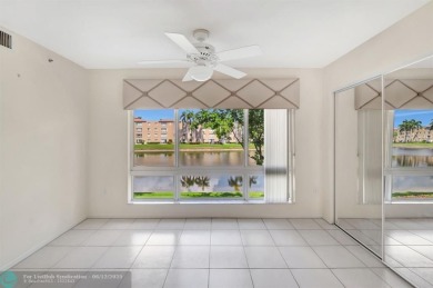 Experience stunning lake views from this beautifully updated on Westchester Golf and Country Club in Florida - for sale on GolfHomes.com, golf home, golf lot