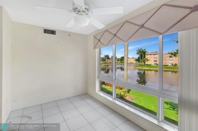 Experience stunning lake views from this beautifully updated on Westchester Golf and Country Club in Florida - for sale on GolfHomes.com, golf home, golf lot