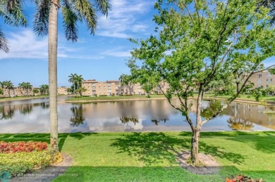 Experience stunning lake views from this beautifully updated on Westchester Golf and Country Club in Florida - for sale on GolfHomes.com, golf home, golf lot