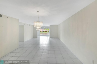 Experience stunning lake views from this beautifully updated on Westchester Golf and Country Club in Florida - for sale on GolfHomes.com, golf home, golf lot