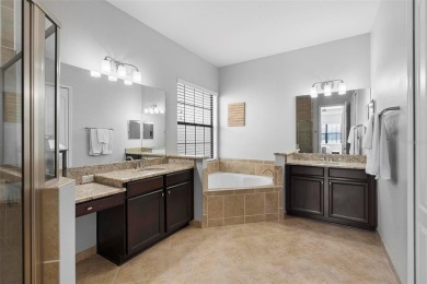 Discover luxury living in this exquisite five-bedroom on Eagle Creek Golf Club in Florida - for sale on GolfHomes.com, golf home, golf lot