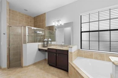 Discover luxury living in this exquisite five-bedroom on Eagle Creek Golf Club in Florida - for sale on GolfHomes.com, golf home, golf lot