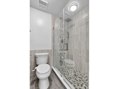 THIS BEAUTIFUL TOWNHOUSE, IS TOTALLY REVOVATED AND MOVE IN on Deer Creek Golf Club in Florida - for sale on GolfHomes.com, golf home, golf lot