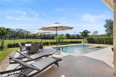 Discover luxury living in this exquisite five-bedroom on Eagle Creek Golf Club in Florida - for sale on GolfHomes.com, golf home, golf lot