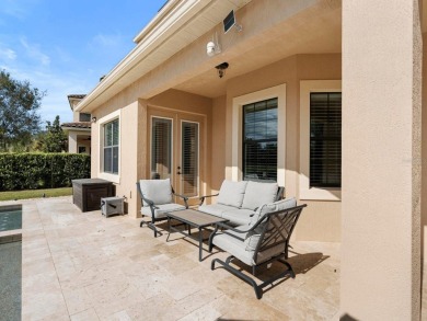 Discover luxury living in this exquisite five-bedroom on Eagle Creek Golf Club in Florida - for sale on GolfHomes.com, golf home, golf lot