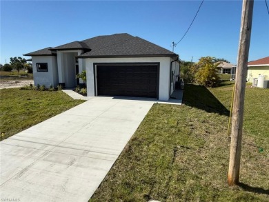 Welcome to a breathtaking new construction single-family home on Del Tura Golf and Country Club in Florida - for sale on GolfHomes.com, golf home, golf lot